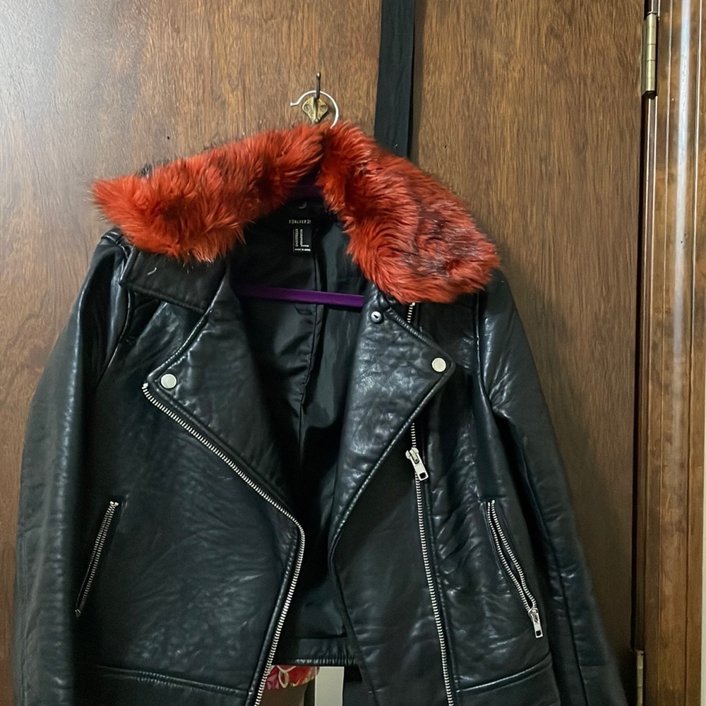 Black leather jacket with red furry collar